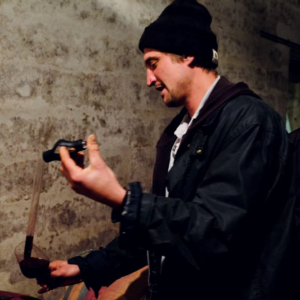 Bastian Wolber in his cellar while tasting his wine.